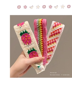 Detail of three handmade crochet floral headbands for girls in vintage French style