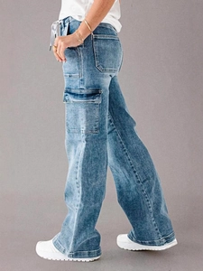 Women's high waist straight leg cargo jeans in blue denim featuring multiple utility pockets