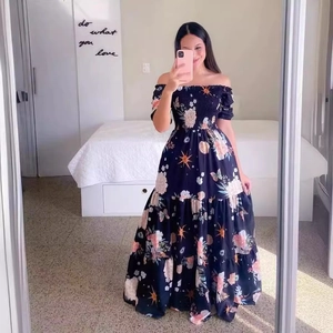 Off-shoulder black floral maxi dress with sunflower and butterfly prints in a tiered design