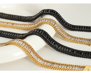 Detailed view of flat mesh bracelets with baguette-cut zircons in gold and black finishes