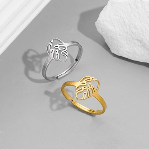 Minimalist stainless steel palm leaf rings in gold and silver with adjustable open bands