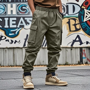 Outdoor street style shot of olive green cargo pants with drawstring waist and pockets