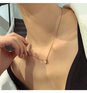 Rose gold titanium steel necklace featuring frosted double butterfly pendants on a thin chain