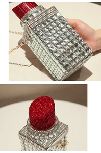 Lipstick-shaped evening clutch with silver rhinestones and red crystal top detail