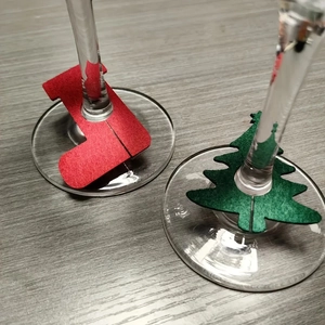 Felt Christmas wine glass charms with red sock and green tree shapes for holiday party