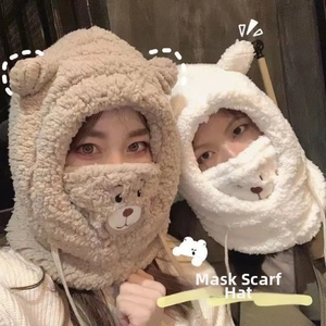 Detail of faux fur 3-in-1 hat with integrated scarf and bear mask for winter warmth