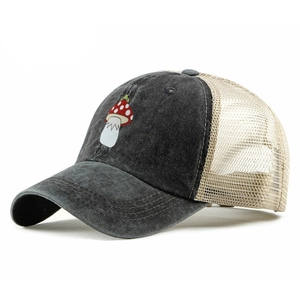 Detail view of vintage washed trucker hat with mushroom embroidery and breathable mesh back
