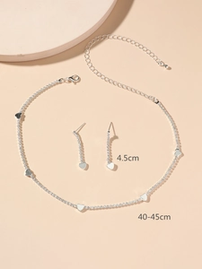 Detail view of rhinestone heart necklace and earrings set with 4.5cm drop length