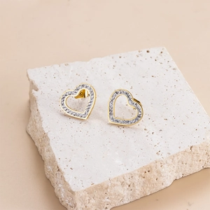 Elegant gold-plated stainless steel hollow heart stud earrings with cubic zirconia stones