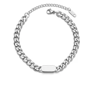 Close-up of polished stainless steel Cuban link bracelet with engravable blank nameplate