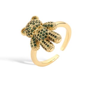 Sweet teddy bear ring in gold plating featuring green zircon accents and adjustable open band