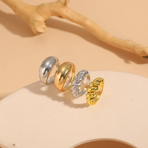 Detailed view of 14K gold and silver plated minimalist smooth and twisted band rings