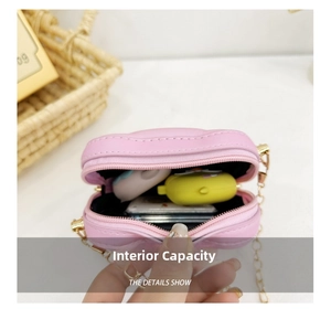 Detailed interior view of a pink mini shoulder bag with chain, showing storage capacity