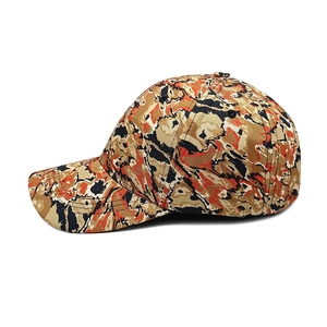 Side detail of cotton baseball cap featuring orange and black tiger camo texture