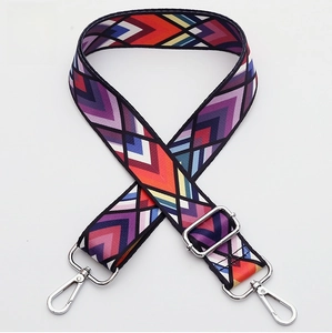 Detailed view of wide woven strap 355 with colorful geometric patterns and silver hardware