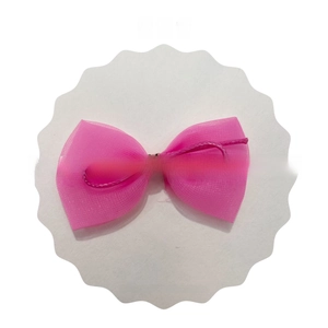 Close-up of pink mesh bow with striped center for hair clips and doll accessories