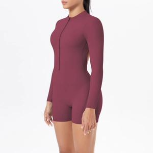 Close-up of deep red long sleeve bodysuit featuring a front zipper and cutout back detail
