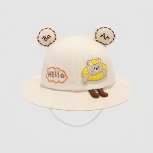 Detailed view of kids bucket hat with 3D bear ears and adjustable chin strap