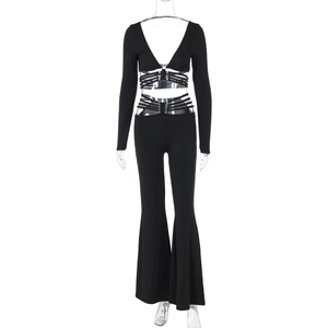 Detail of black V-neck crop top with criss-cross waist ties and wide-leg flare pants