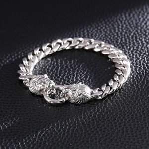 Men's silver stainless steel Cuban link bracelet with lion head clasp at 45-degree angle