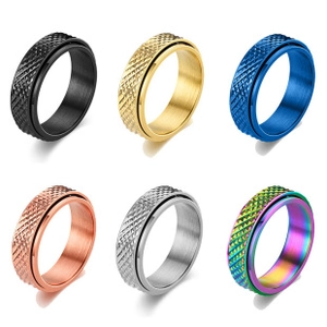 Detailed view of six colorful spinner rings with knurled texture in a vertical grid