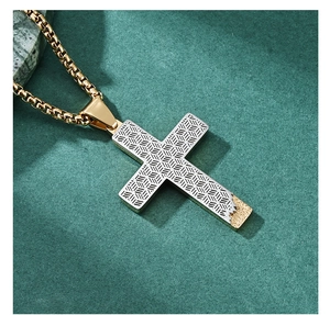 Detail of silver woven texture cross pendant with gold-tone matte accent and chain