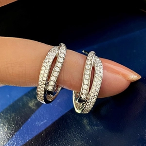 Fashionable interlocking double hoop stud earrings with pavé set white crystals for women