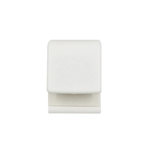 Detail of white plastic toothpaste squeezer with adhesive back for wall mounting