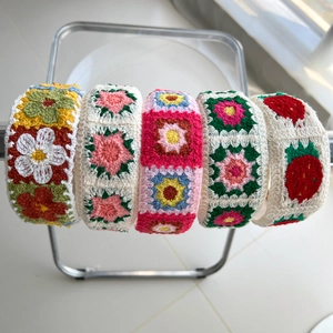 Knotted knit floral headbands with handmade crochet strawberry and flower patterns