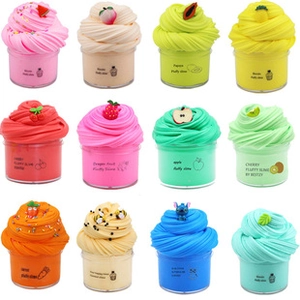 Set of 12 colorful fluffy DIY slimes with fruit charms in a 3x4 grid layout