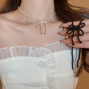 Elegant vintage pearl bow necklace for women featuring stylish beaded choker design