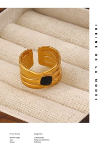 Detail of 18K gold-plated stainless steel wide band ring with black square inlay