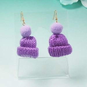 Handmade purple knitted hat earrings with soft pom-poms on a gold hook for winter fashion