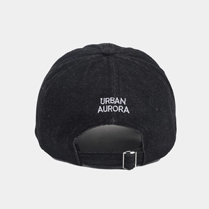 Detail view of denim baseball cap back with white URBAN AURORA embroidery and metal buckle