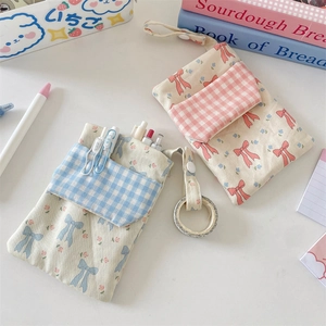 Floral nurse pocket protector with bow print and plaid pocket for pens and stationery