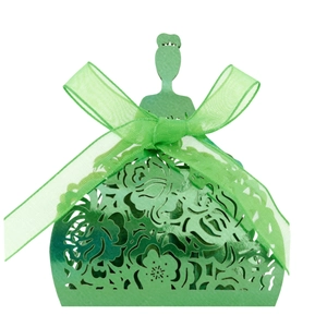 Detail of green laser-cut wedding favor box in princess dress shape with ribbon