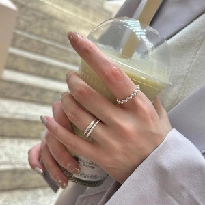 Minimalist S925 sterling silver geometric bead ring set worn by a female hand model
