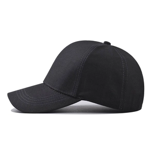 Classic black cotton baseball cap in minimalist six-panel style with pre-curved brim