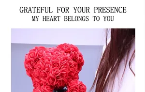 Detail view of a red rose bear with black ribbon, handcrafted floral teddy bear gift
