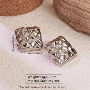 Macro shot of square stainless steel stud earrings with woven texture and 2.26cm dimensions