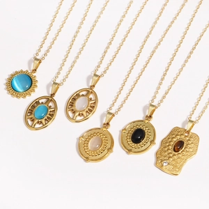 Various vintage titanium steel necklaces with colorful natural stone pendants and 14K gold finish
