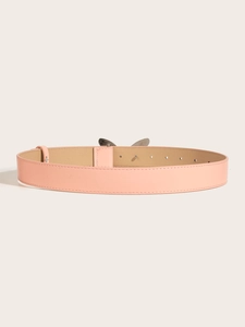 Detailed top view of pink faux leather belt with silver metal buckle and adjustment holes
