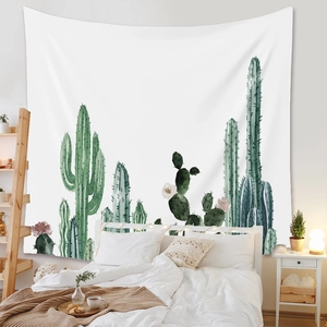 Bedroom wall decor detail showing bohemian cactus tapestry in hand-painted watercolor style