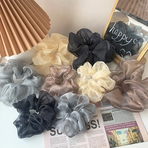 Set of organza hair scrunchies in various neutral colors for french style hair styling