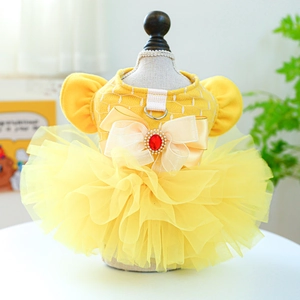 Detail view of yellow dog wedding dress with mesh layers, bow, and D-ring buckle