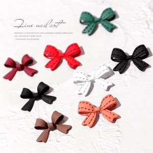 Matte alloy bow nail art charms in multiple colors with realistic stitch texture
