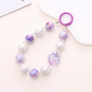 Detail of purple and white iridescent beaded phone strap with a large heart pendant charm