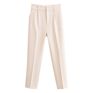 Detail shot of beige high-waist trousers featuring elegant central crease line detail