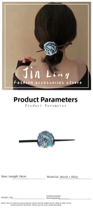 Detailed view of Cloisonné hair stick with blue bird and plum blossom motif decoration