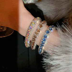 Sparkling rhinestone circular buckle bracelets in silver, gold, and deep blue finishes